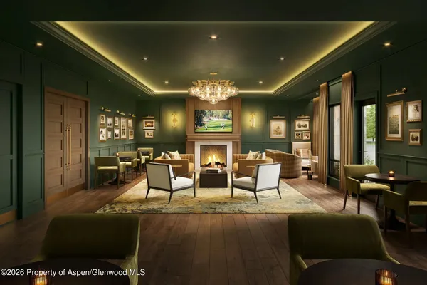 a living room with fireplace furniture and a chandelier