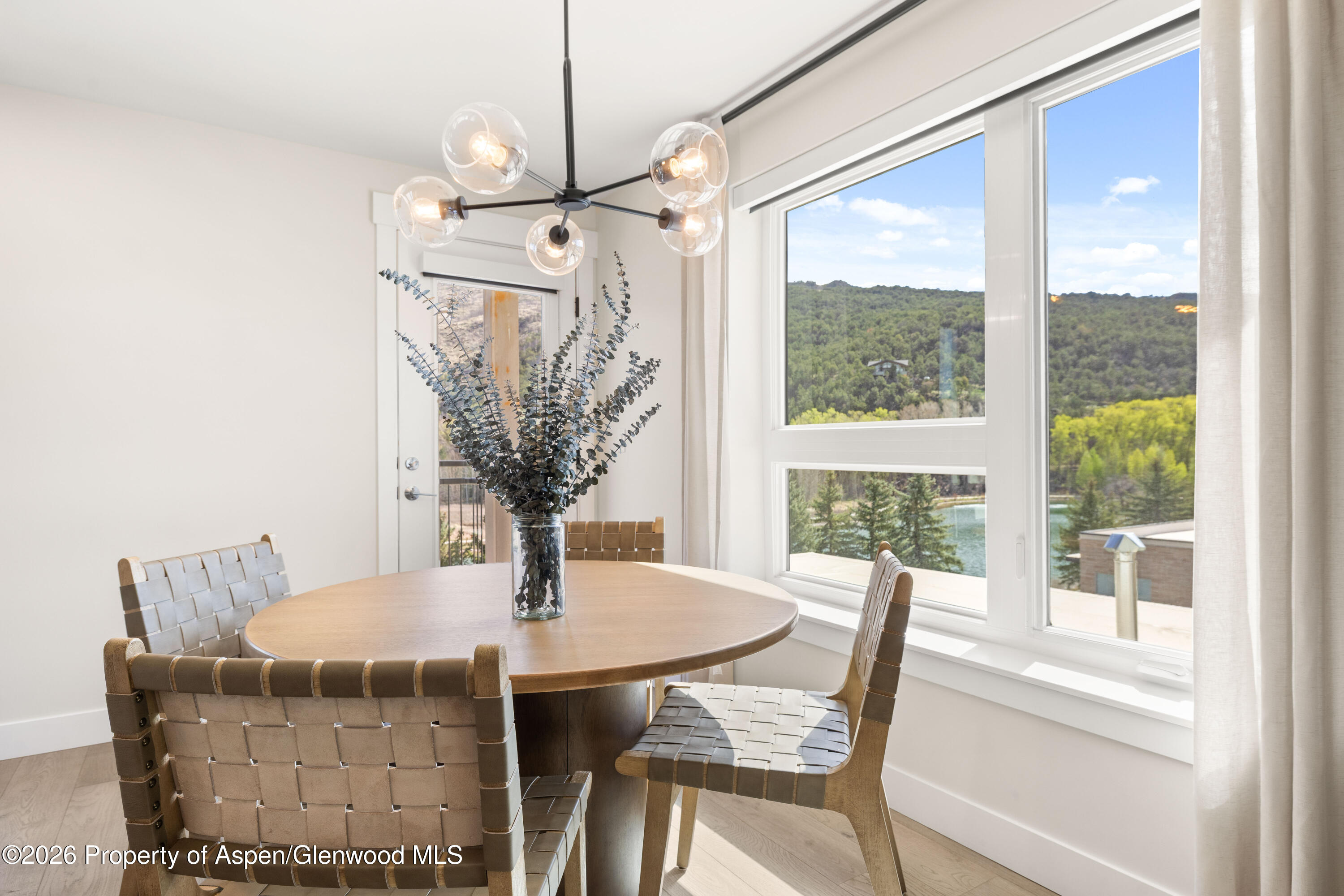 85 Kodiak Drive, Unit 304 Basalt, CO 81621 - Photo 5 of 21 a view of a dining room with furniture window and outside view