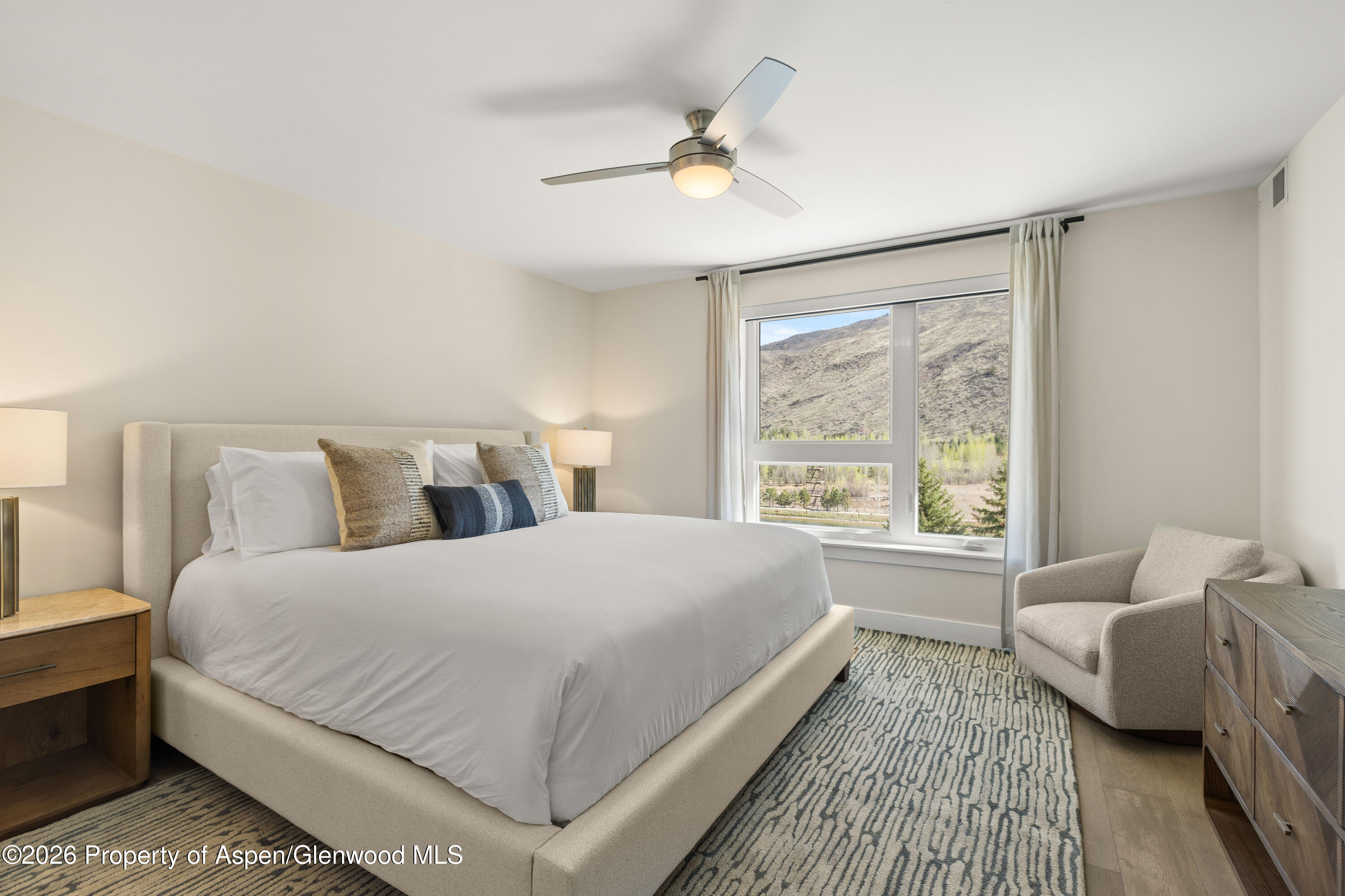 85 Kodiak Drive, Unit 304 Basalt, CO 81621 - Photo 9 of 21 a bedroom with a large bed and a large window