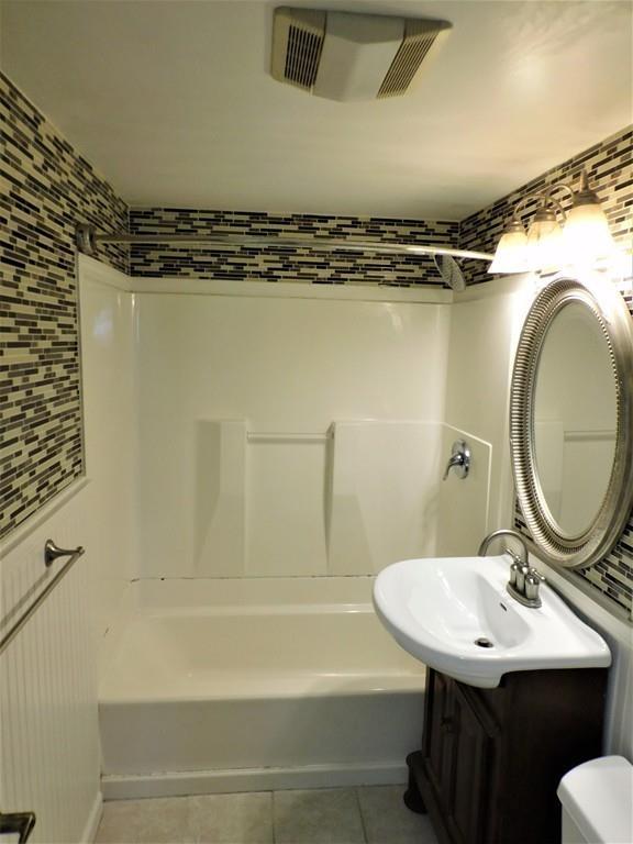 94 Surrey Road Springfield, MA 01118 - Photo 21 of 36 a bathroom with a sink and a mirror
