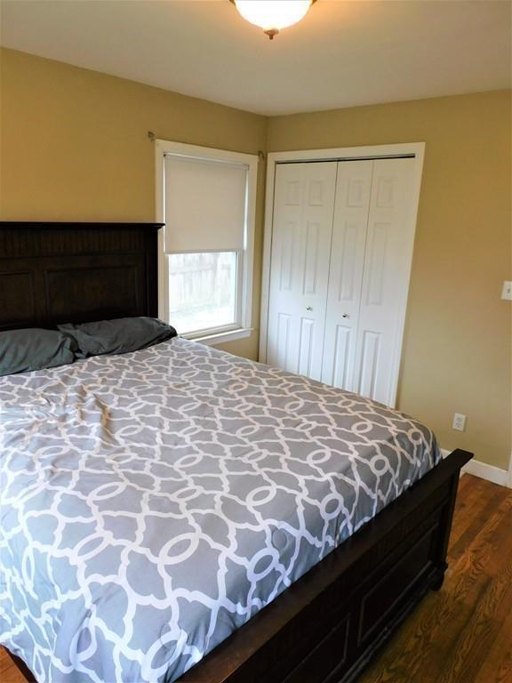 94 Surrey Road Springfield, MA 01118 - Photo 23 of 36 a bed sitting in a bedroom next to a window and a dresser