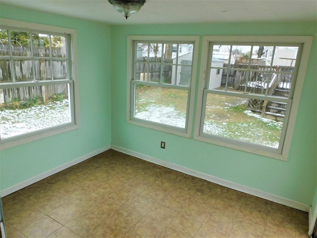 94 Surrey Road Springfield, MA 01118 - Photo 29 of 36 a view of an empty room with a window