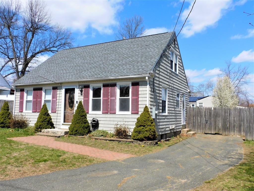 94 Surrey Road Springfield, MA 01118 - Photo 3 of 36 a front view of a house with a yard and potted plants