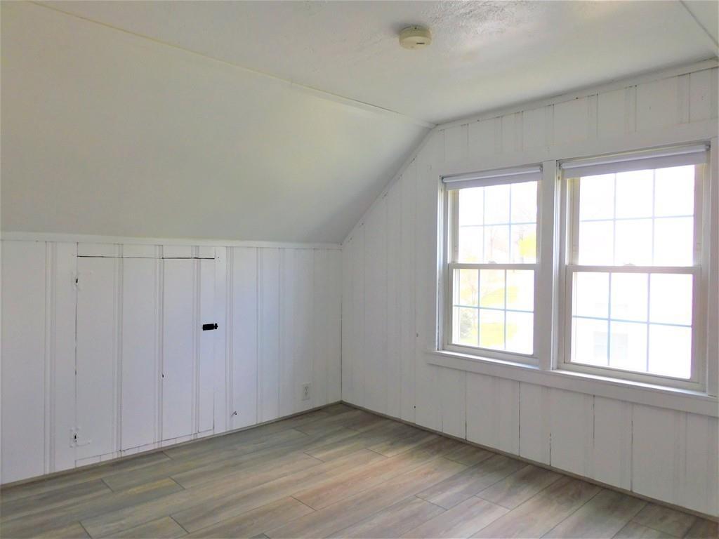 94 Surrey Road Springfield, MA 01118 - Photo 33 of 36 an empty room with wooden floor and windows