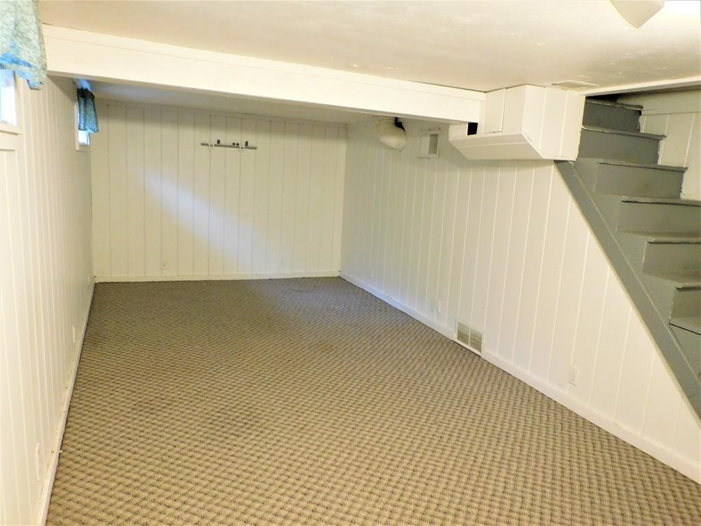 94 Surrey Road Springfield, MA 01118 - Photo 35 of 36 a view of a room with wooden floor and brick wall
