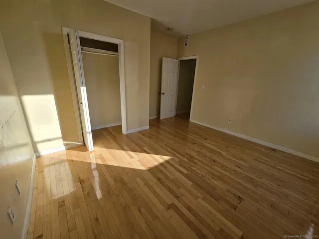a view of a livingroom with wooden floor