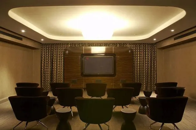 a media room with chairs and a projector