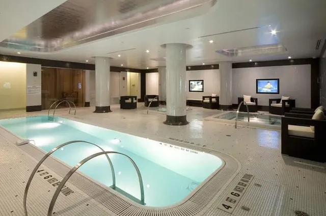 a room with lots of dining table and chairs