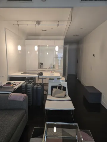 a kitchen with a table chairs stove and cabinets