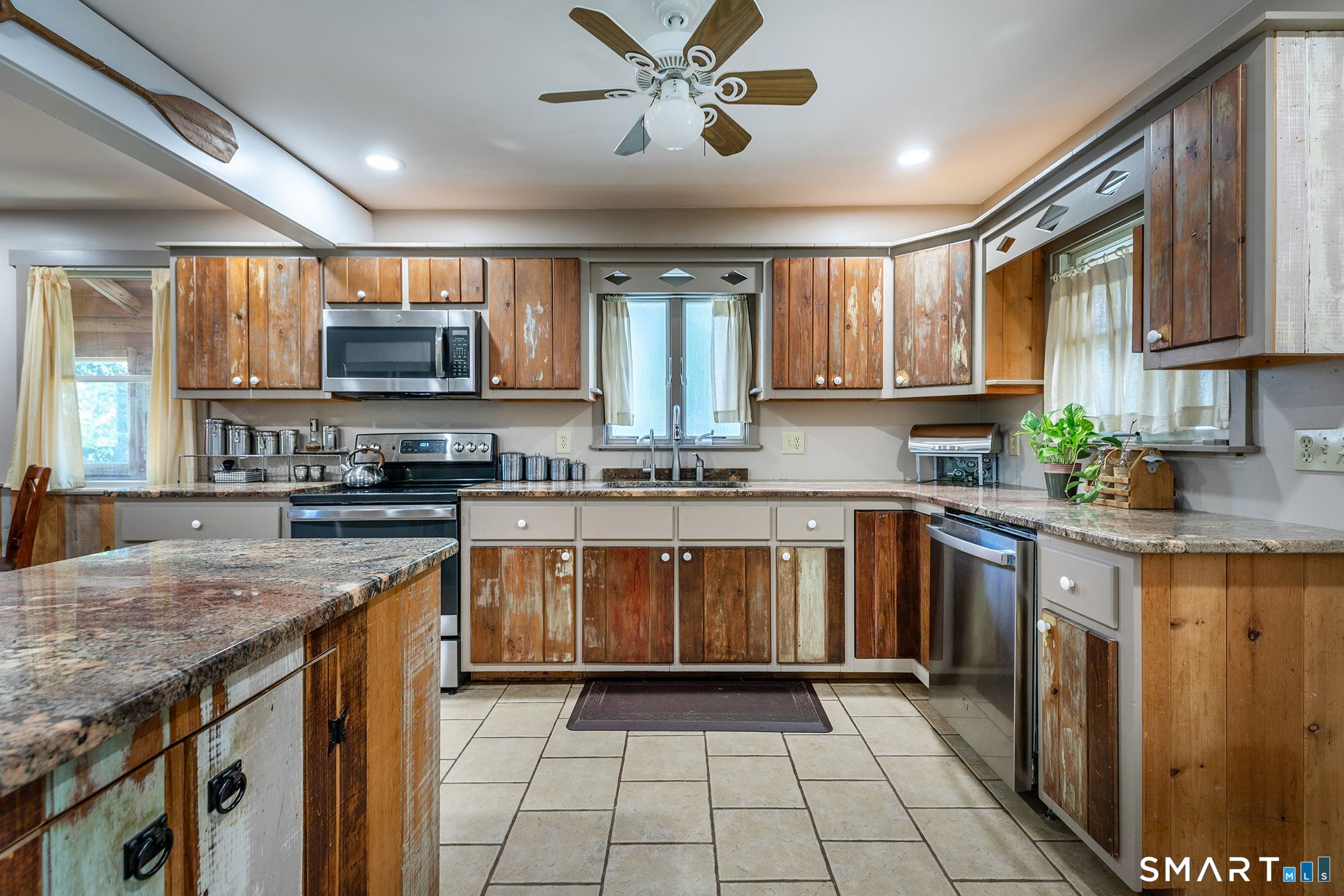 28 Fox Run New Fairfield, CT 06812 - Photo 15 of 24 a kitchen with stainless steel appliances granite countertop a stove sink and cabinets