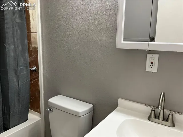 a bathroom with a sink and a toilet