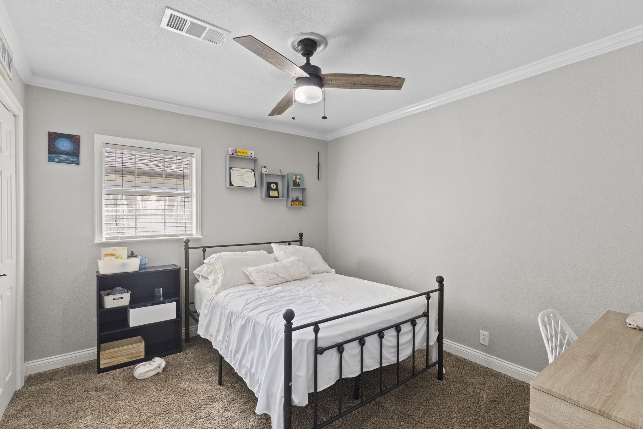 1006 Montgomery Street Port Neches, TX 77651 - Photo 11 of 29 a bedroom with a bed and a chandelier