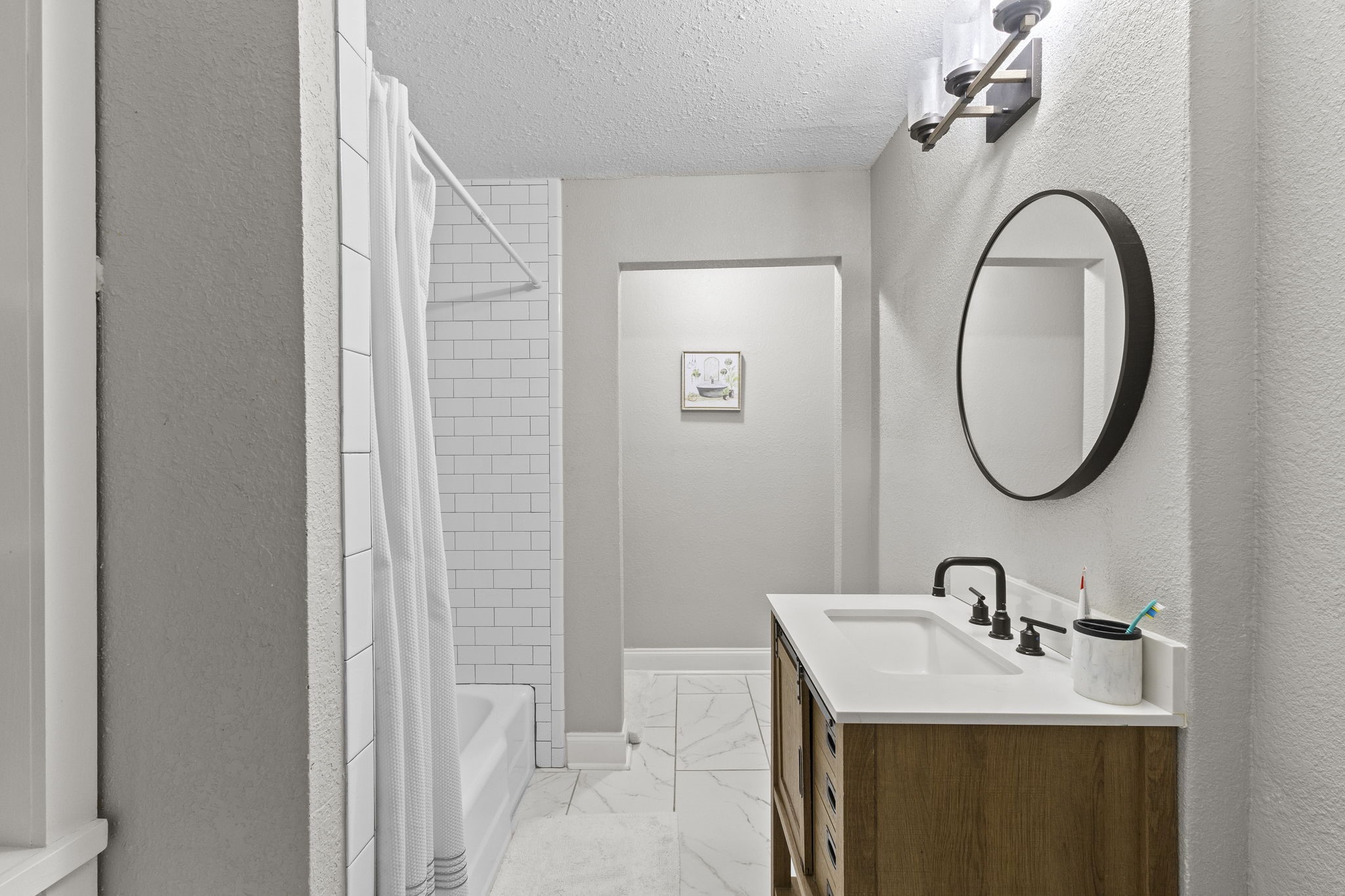 1006 Montgomery Street Port Neches, TX 77651 - Photo 13 of 29 a bathroom with a sink and a mirror