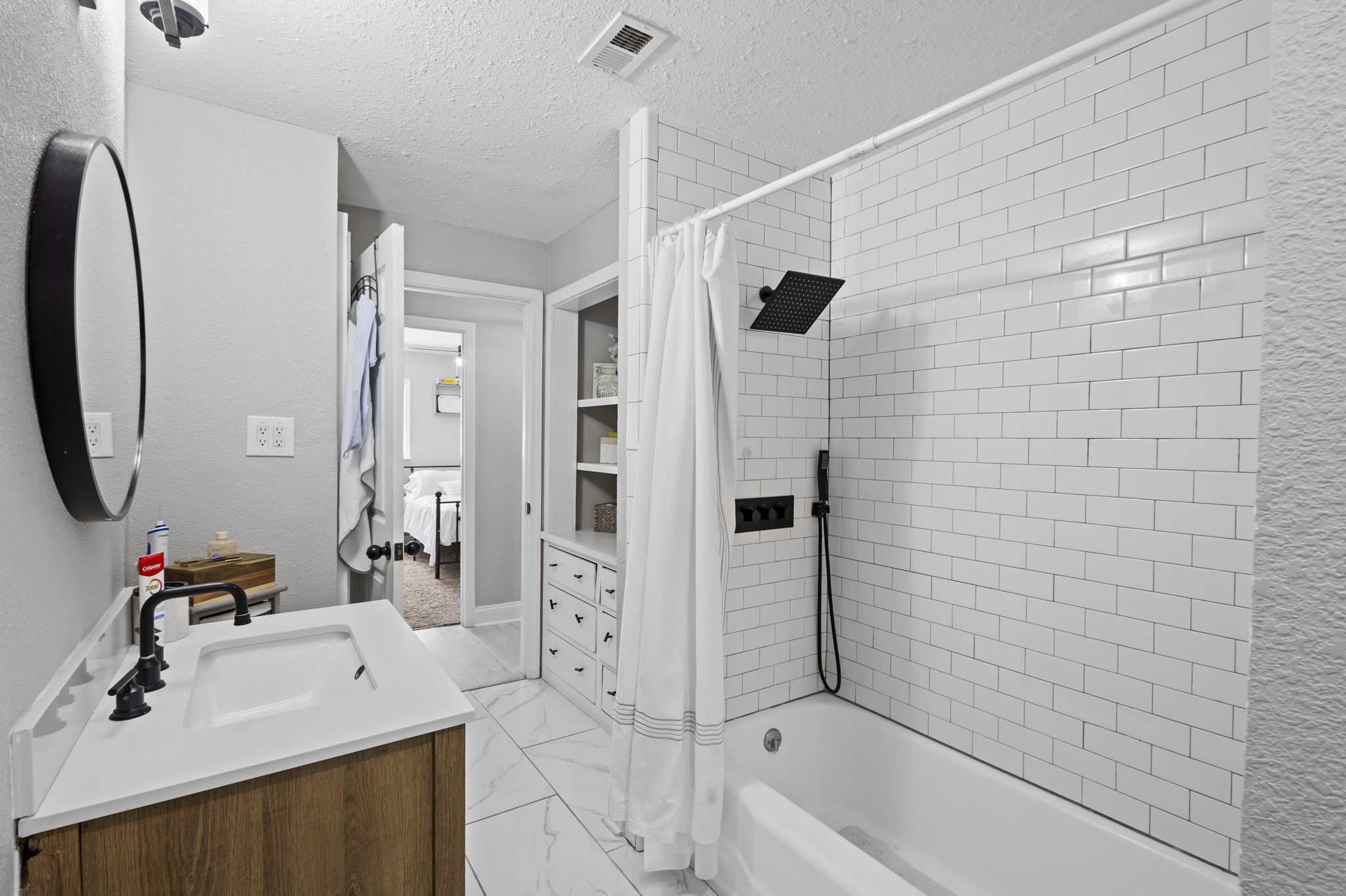 1006 Montgomery Street Port Neches, TX 77651 - Photo 14 of 29 a bathroom with a sink a toilet a mirror and shower