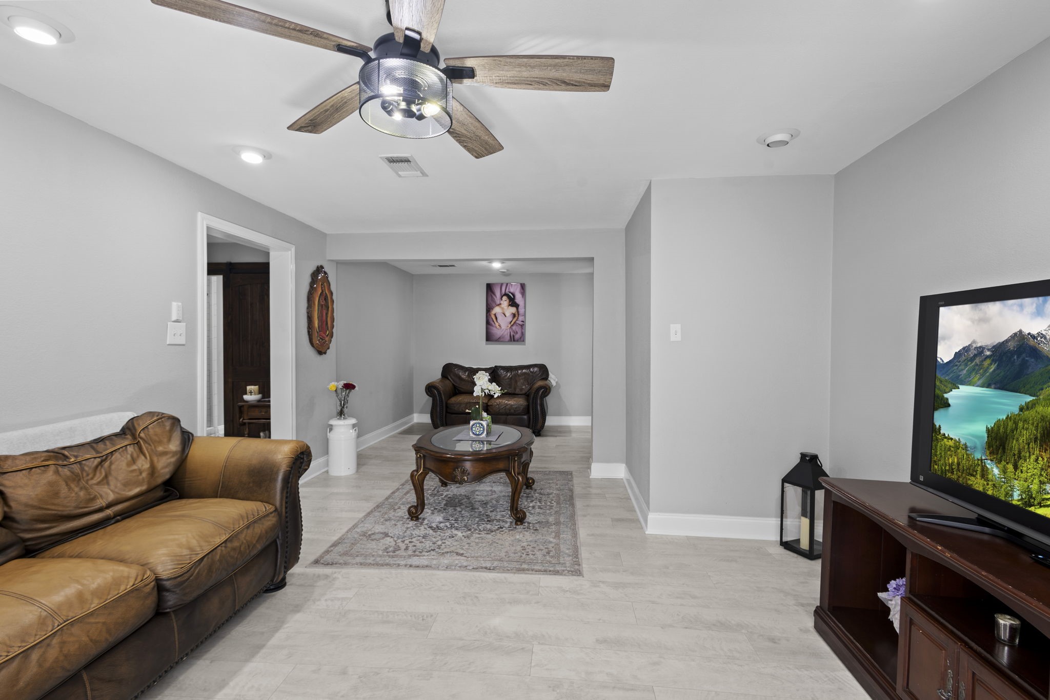 1006 Montgomery Street Port Neches, TX 77651 - Photo 20 of 29 a living room with furniture a flat screen tv and a window