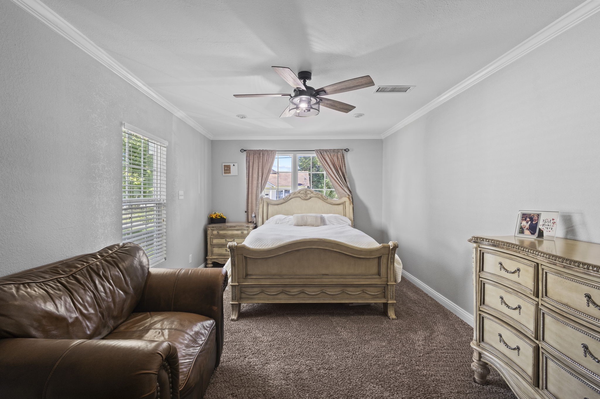 1006 Montgomery Street Port Neches, TX 77651 - Photo 26 of 29 a bed room with a bed and a couch