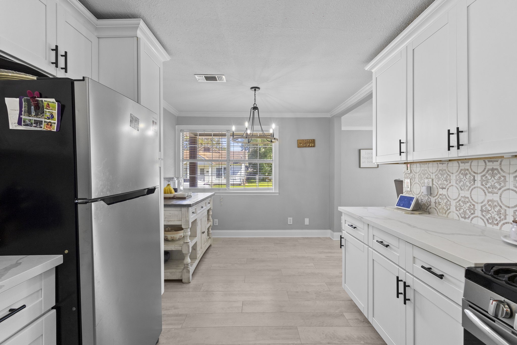 1006 Montgomery Street Port Neches, TX 77651 - Photo 9 of 29 a kitchen with a refrigerator and a sink