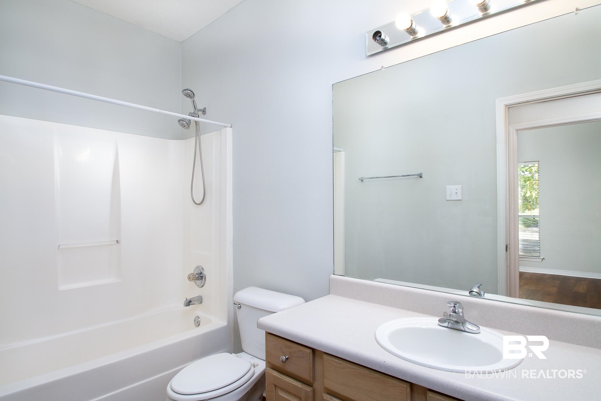 29894 St Barbara Street Daphne, AL 36526 - Photo 11 of 17 Hall Bathroom features a full bath with shower combination and vanity