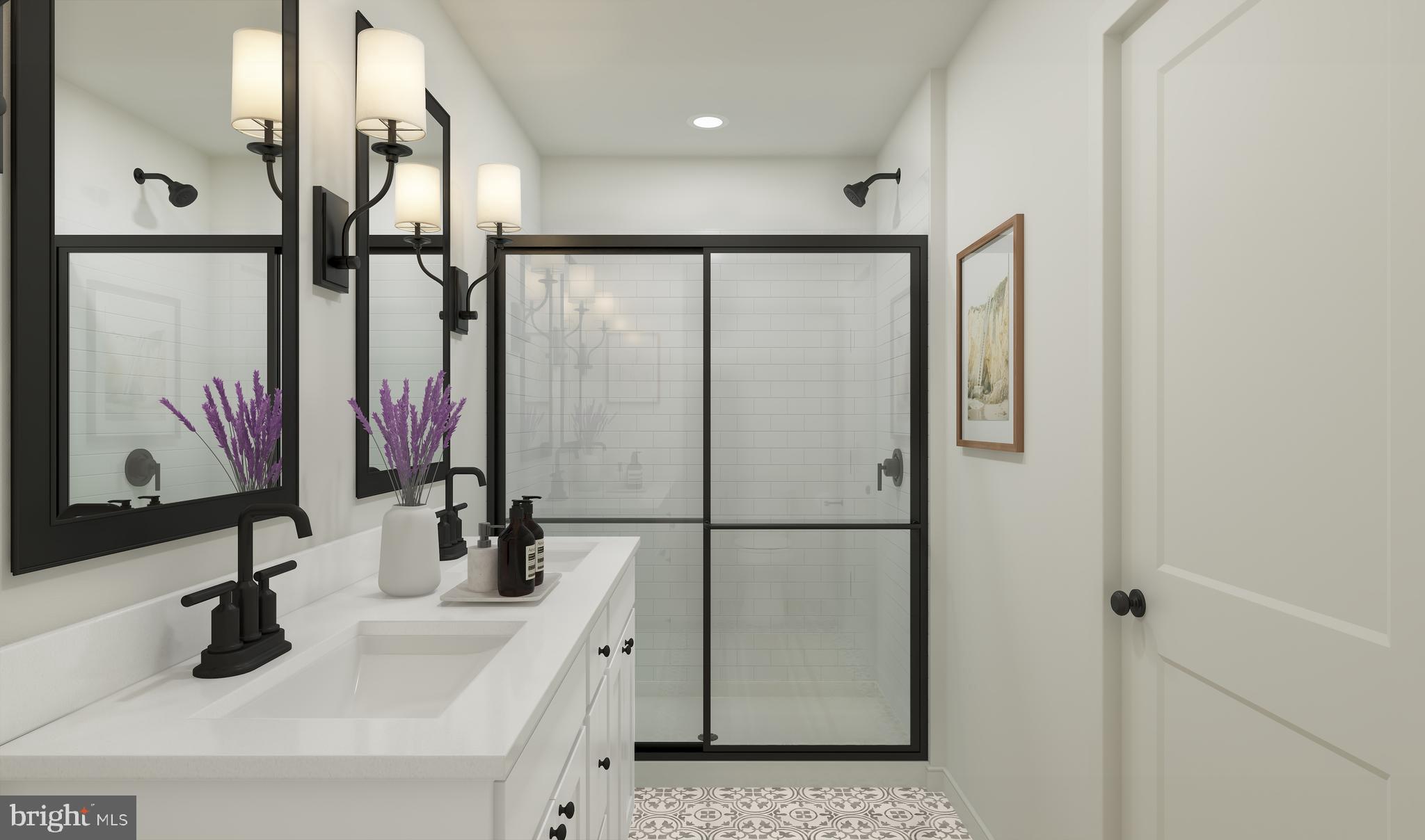 35121 Wilderness Shores Way Locust Grove, VA 22508 - Photo 11 of 53 a bathroom with a double vanity sink and a mirror