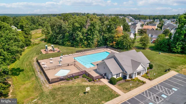 swimming pool view with a outdoor seating