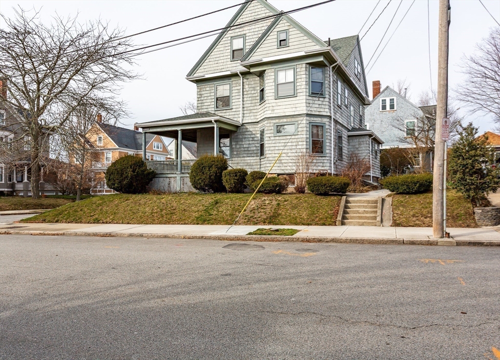 445 Madison Street Fall River, MA 02720 - Photo 4 of 42 a front view of a house with a yard