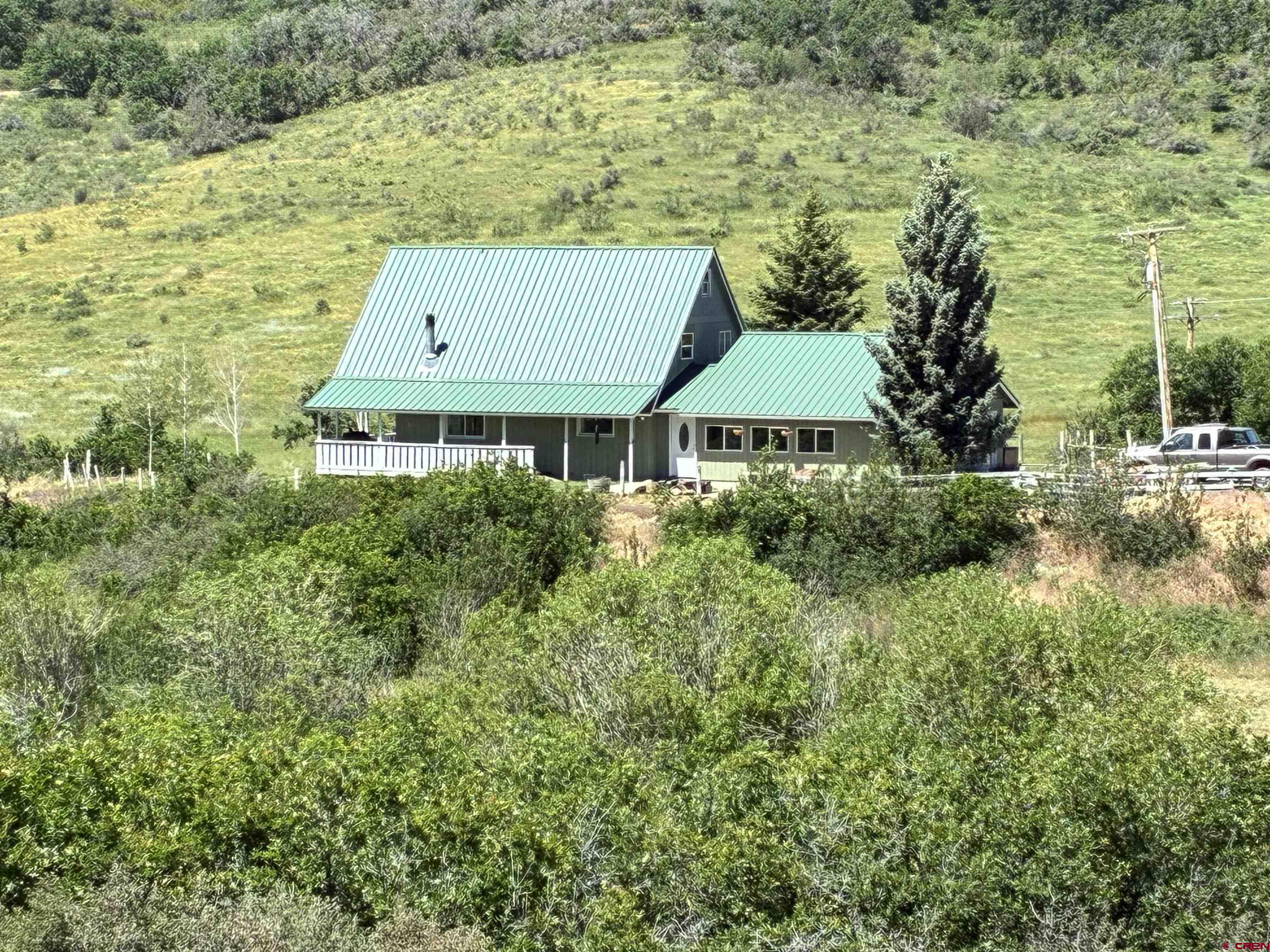 19253 Stevens Gulch Road Paonia, CO 81428 - Photo 2 of 43 a aerial view of a house with a yard and lake view