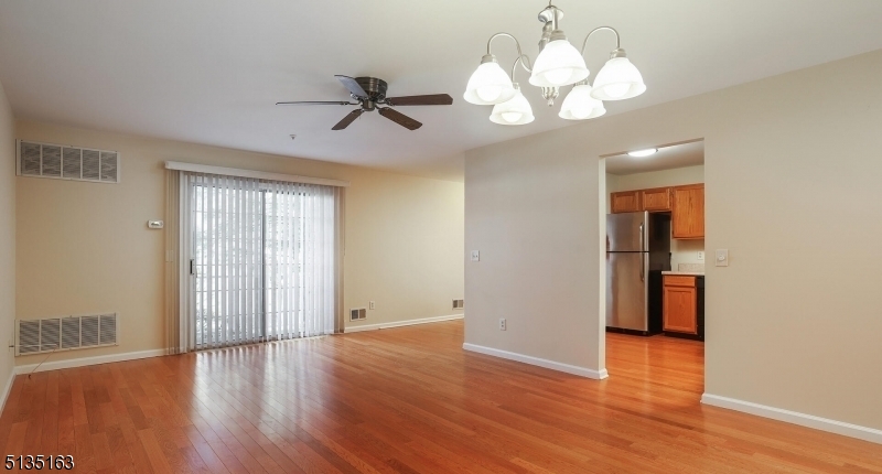 250 Potomac Drive Bernards, NJ 07920 - Photo 9 of 22 a view of an empty room with wooden floor and window