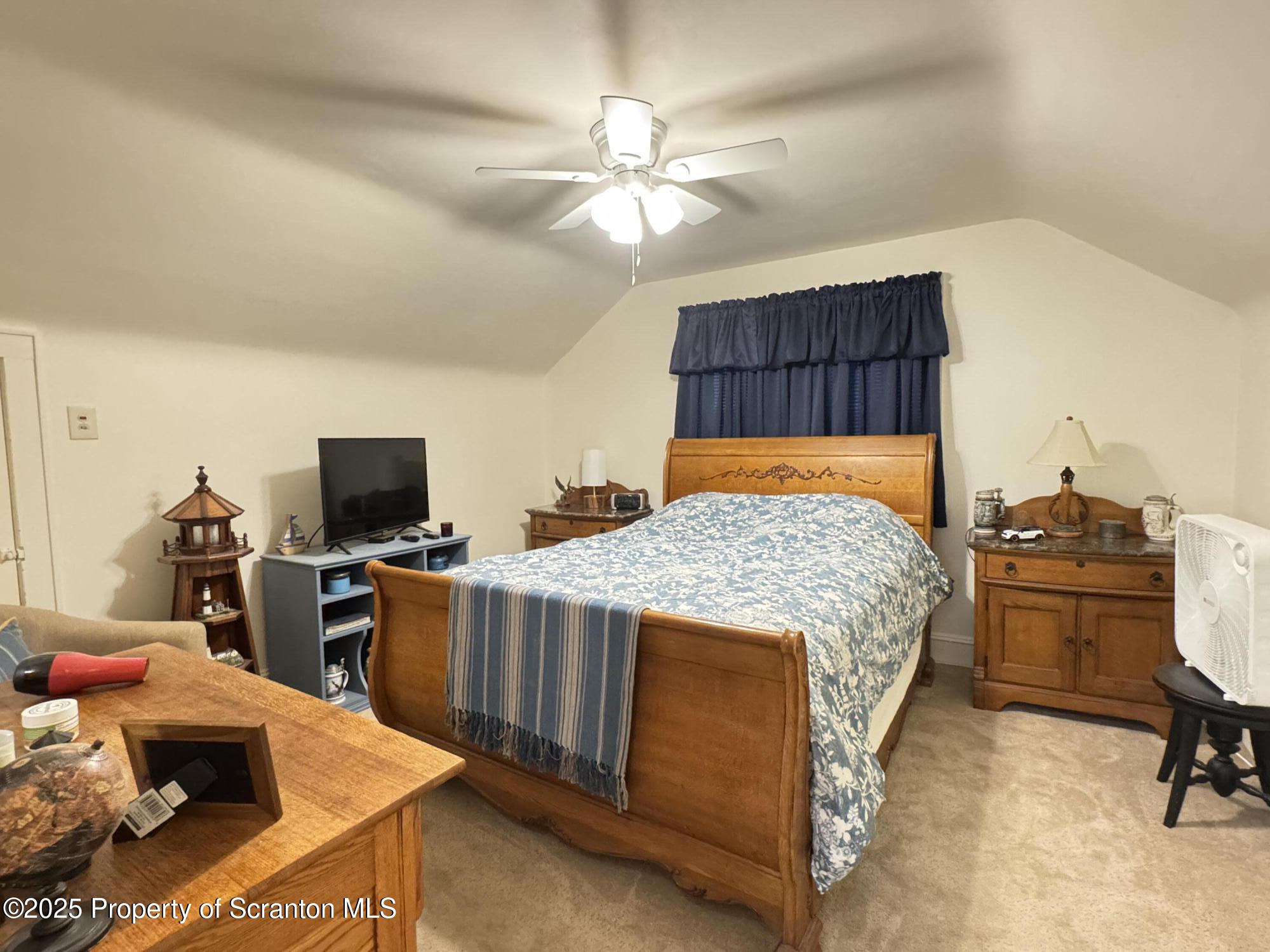 954 Lattimer Road Hazleton, PA 18202 - Photo 11 of 16 a bedroom with a bed and a flat screen tv