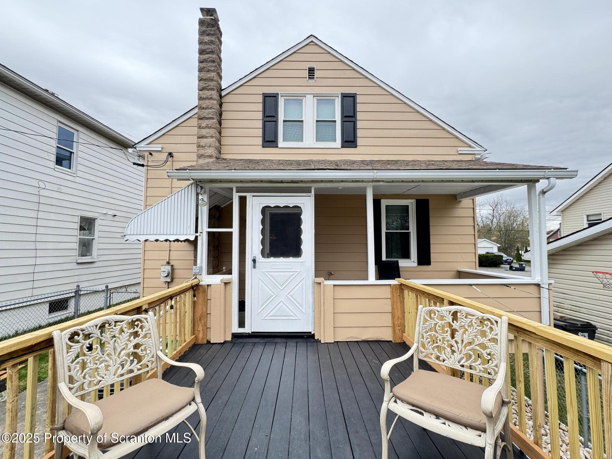 954 Lattimer Road Hazleton, PA 18202 - Photo 15 of 16 a view of a house with wooden deck and furniture