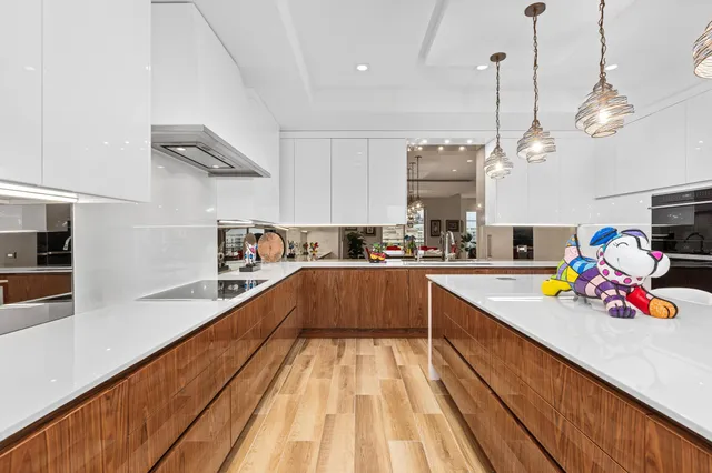 a kitchen with stainless steel appliances granite countertop a stove and cabinets