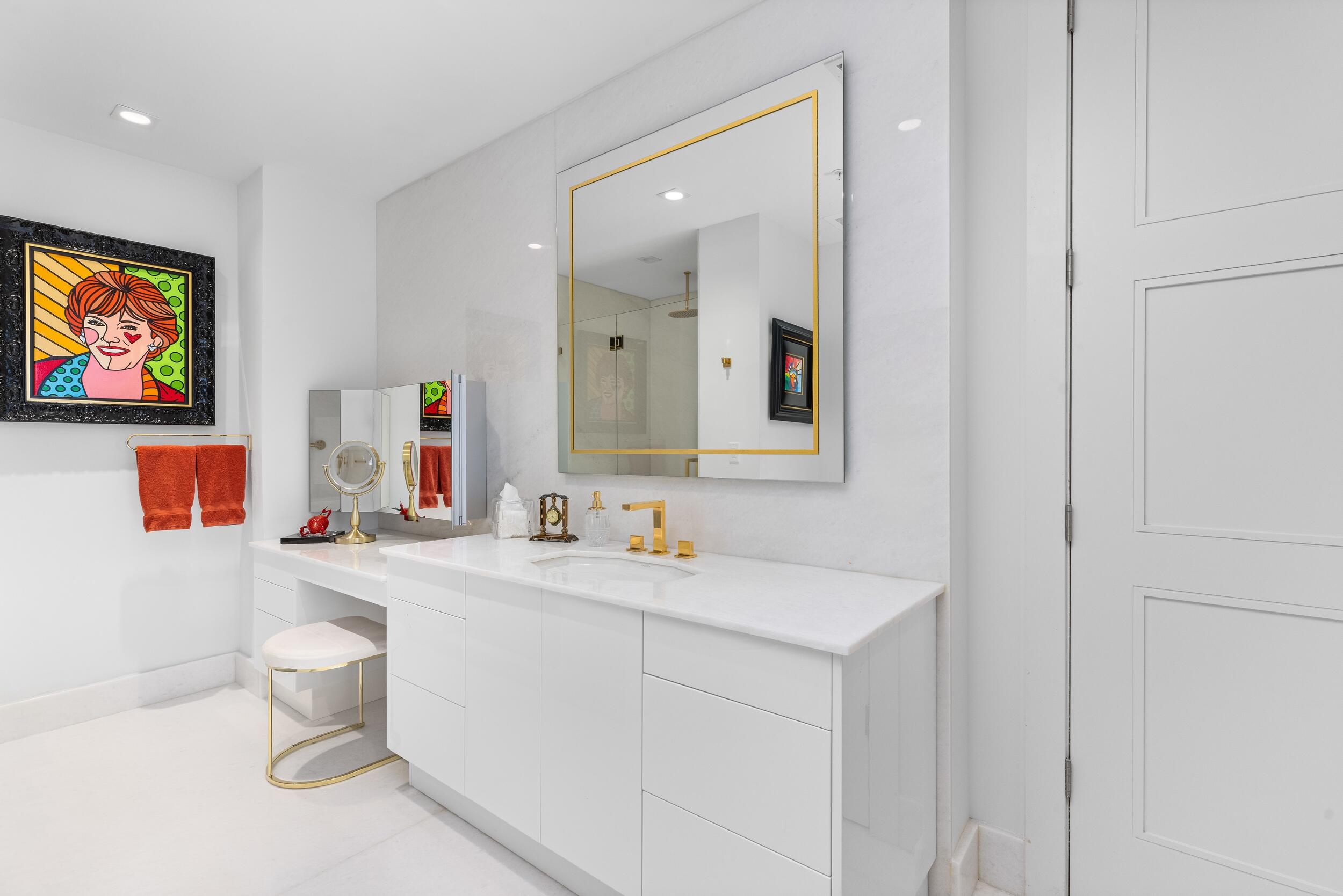 155 East Boca Raton Road, Unit 812 Boca Raton, FL 33432 - Photo 20 of 54 a bathroom with a sink mirror and toilet