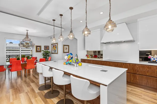 an open kitchen with a table and chairs