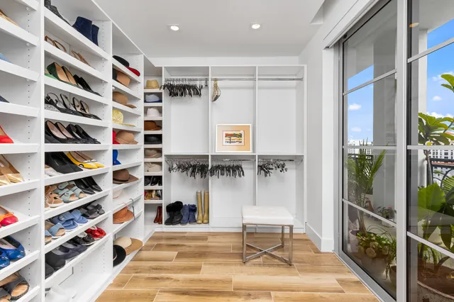 a room with lots of books and a book shelf