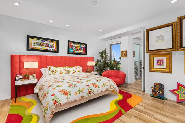 a bedroom with a bed and dresser