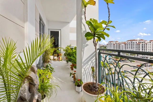 a vase of flowers sitting on a floor