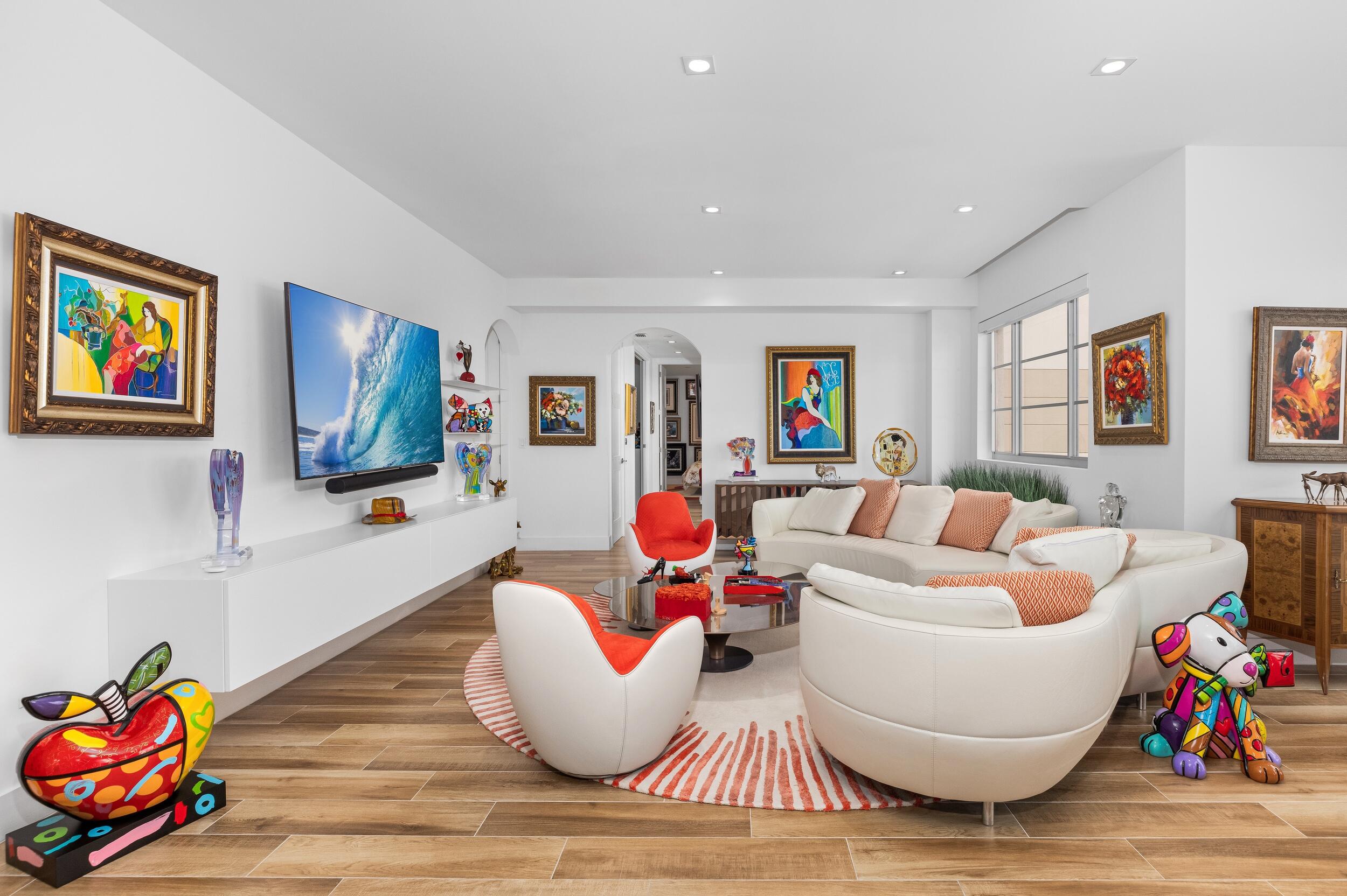 155 East Boca Raton Road, Unit 812 Boca Raton, FL 33432 - Photo 10 of 54 a living room with furniture and a wooden floor