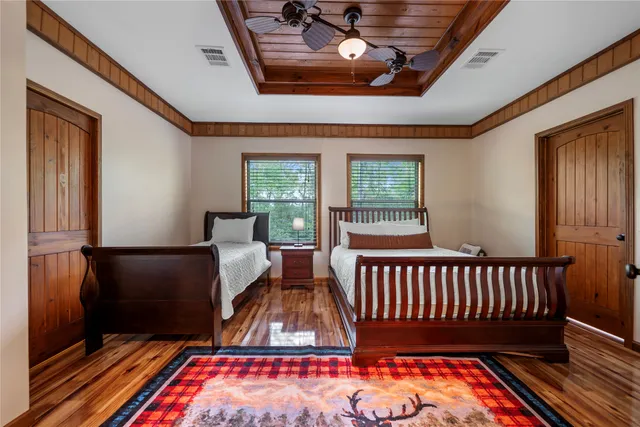 a bedroom with furniture and a window