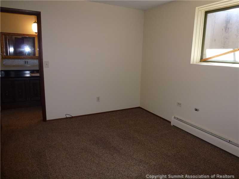 70 Evergreen Road, Unit 104 Dillon, CO 80435 - Photo 12 of 22 a view of an empty room with chandelier fan and window