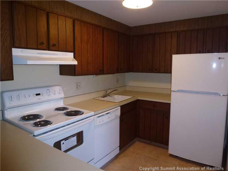 70 Evergreen Road, Unit 104 Dillon, CO 80435 - Photo 6 of 22 a kitchen with a refrigerator and a stove