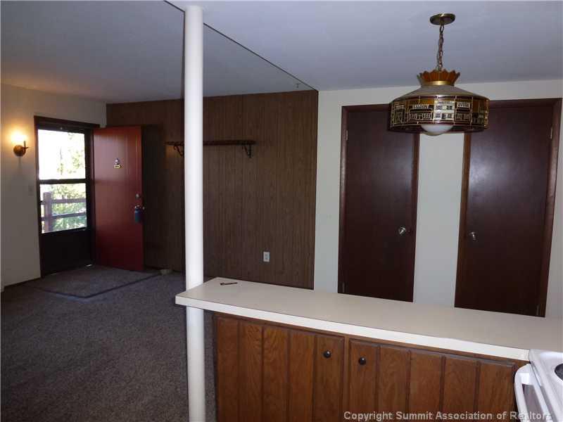 70 Evergreen Road, Unit 104 Dillon, CO 80435 - Photo 7 of 22 a view of a hallway with a chandelier