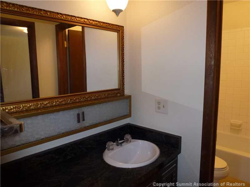 70 Evergreen Road, Unit 104 Dillon, CO 80435 - Photo 9 of 22 a bathroom with a sink and a mirror