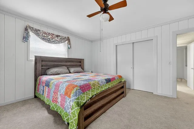 a kitchen with kitchen island granite countertop a sink stove and refrigerator