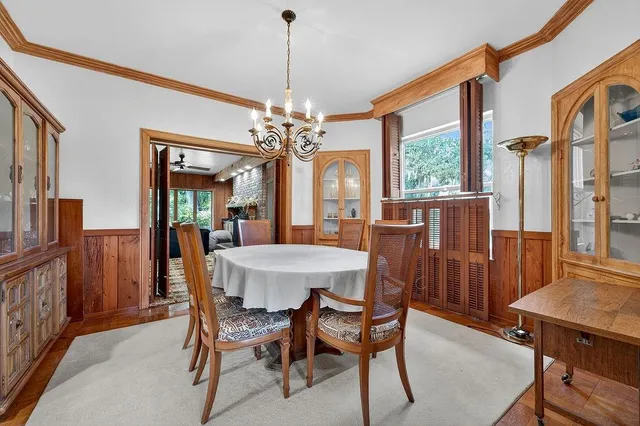 a bed room with a bed and a chandelier