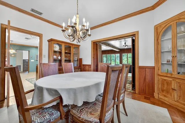 a bathroom with a granite countertop sink a toilet and tub