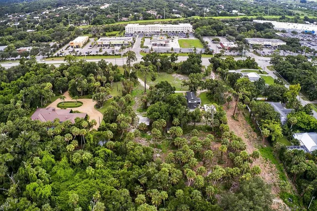 a bathroom with a sink a toilet a mirror and shower