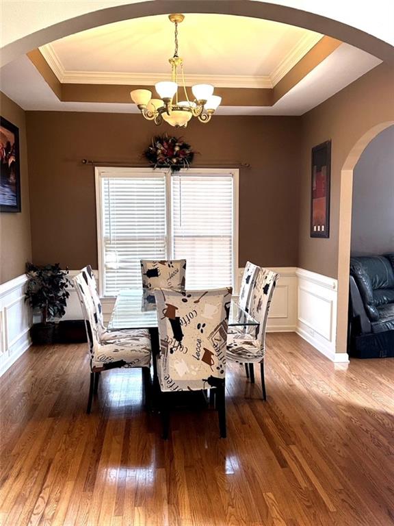 239 Sweet Cane Trail Grayson, GA 30017 - Photo 11 of 30 a view of a dining room with furniture and wooden floor
