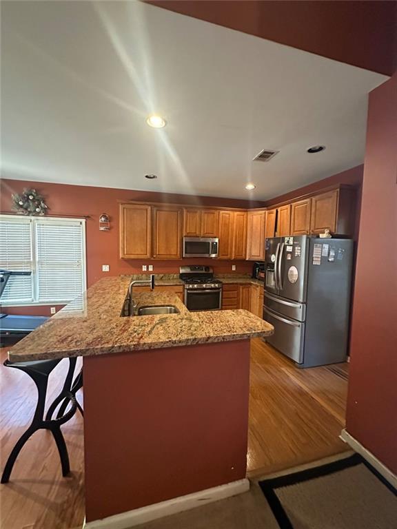 239 Sweet Cane Trail Grayson, GA 30017 - Photo 16 of 30 a large kitchen with stainless steel appliances a large counter top and a refrigerator