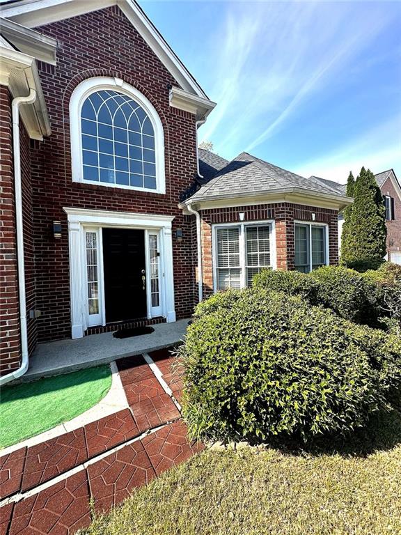 239 Sweet Cane Trail Grayson, GA 30017 - Photo 2 of 30 a front view of a house with a yard