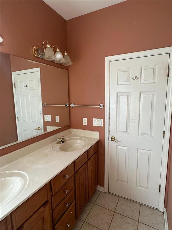 239 Sweet Cane Trail Grayson, GA 30017 - Photo 22 of 30 a bathroom with a sink vanity and mirror