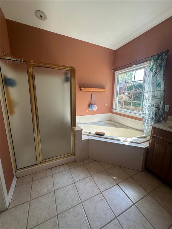 239 Sweet Cane Trail Grayson, GA 30017 - Photo 24 of 30 a bathroom with a granite countertop bathtub a sink and a shower
